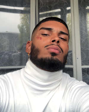 Stylish Young Manin White Turtleneck Wallpaper