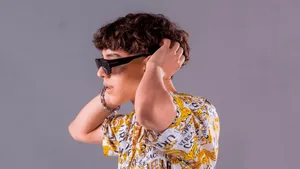 Stylish Youth Sunglasses Pose Wallpaper