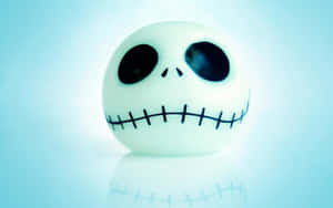 Stylized Skull Figurinewith Stitched Smile Wallpaper