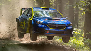 Subaru Rally Car Midair Jump.jpg Wallpaper