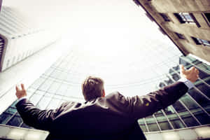 Successful Man Looking At The Buildings Wallpaper