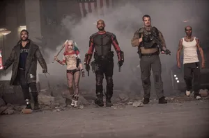 Suicide Squad Team Walking Through Rubble Wallpaper