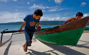 Sulawesi Fishermen Pulling Their Boat Wallpaper