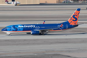 Sun Country Airlines Aircraft On Airport Tarmac Wallpaper