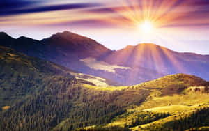 Sun Rise Over Mountainous Landscape Wallpaper