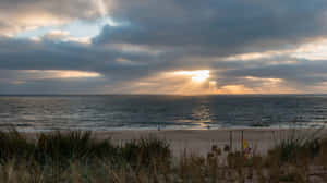 Sunbeams Over Kampen Beach Wallpaper