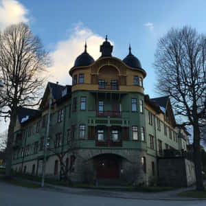 Sunlight Cascading Over Beautiful Norrköping Cityscape Wallpaper