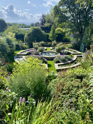 Sunlit Victorian Style Garden Pond Design Wallpaper