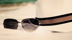 Sunny Beach Day With Essential Accessories Wallpaper