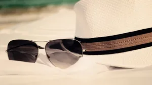 Sunny Beach Day With Essential Accessories Wallpaper