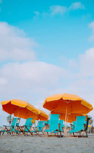 Sunny Beach Umbrellasand Chairs Wallpaper