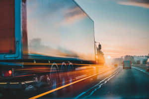 Sunrise Highway Truck Motion Blur Wallpaper