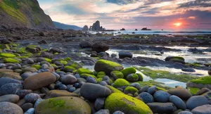 Sunset_at_ Rocky_ Shoreline Wallpaper