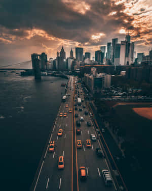 Sunset_ Cityscape_with_ Bridge_and_ Highway.jpg Wallpaper