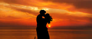 Sunset Couple Kiss Wallpaper