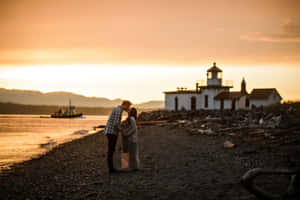 Sunset Embraceat Discovery Park Lighthouse Wallpaper