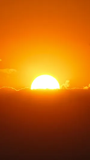 Sunset_ Glow_ Over_ Clouds Wallpaper