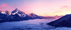 Sunset_ Mountain_ Peaks_ Above_ Clouds.jpg Wallpaper