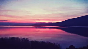Sunset Over A Placid Lake Wallpaper