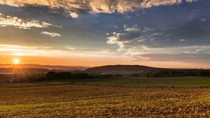 Sunset Over Fertile Farmland Wallpaper