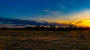 Sunset Over Open Farmland Wallpaper