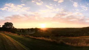 Sunset Over Rolling Farmland Wallpaper