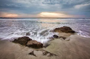 Sunset Over Rugged Coastline Wallpaper