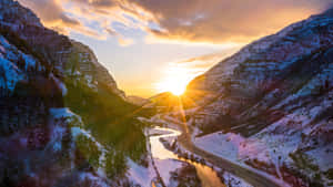 Sunset_ Over_ Snowy_ Canyon_ Road_4 K Wallpaper