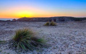 Sunset Over The Chapel Of Saint Pierre In Quiberon, France Wallpaper