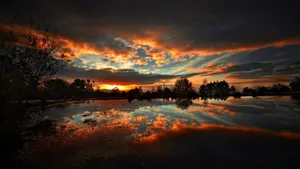 Sunset Over Tranquil Lake Wallpaper