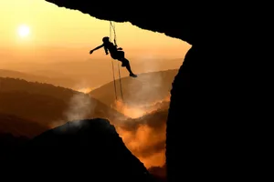 Sunset Rock Climbing Silhouette Wallpaper