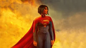 Supergirl Sasha Calle Against Blazing Sky Wallpaper