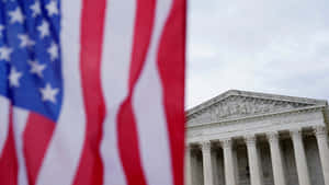 Supreme Court Building Behind American Flag Wallpaper