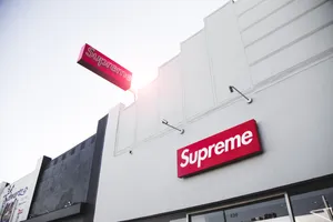 Supreme Skateboarder Making An Impressive Jump Wallpaper