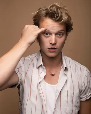 Surprised Man Raising Eyebrow Wallpaper