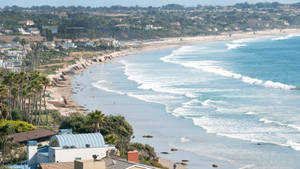 Surrounded By Sandy Beaches And Crystal-clear Waters, Malibu, California Is The Picture Of Paradise. Wallpaper