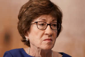 Susan Collins Frown Wallpaper