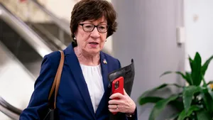 Susan Collins Holding Iphone Wallpaper