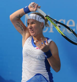 Svetlana Kuznetsova Showing Intense Focus During A Tennis Match. Wallpaper