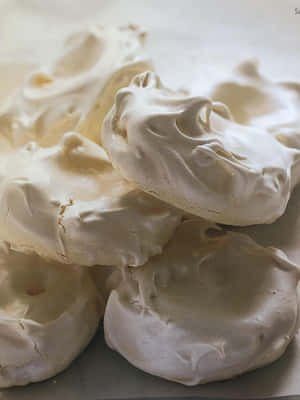 Sweet And Delicious Meringue With A Powdered Sugar Top. Wallpaper