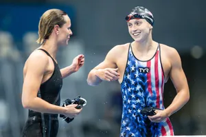 Swimmers Celebrating Victory Wallpaper