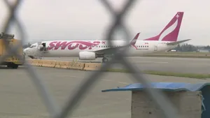 Swoop Airplane At Flight Ramp Wallpaper