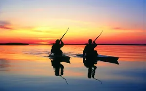 Synchronized Sunset Kayaking Wallpaper