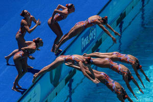 Synchronized Swimming Diving Into Pool Wallpaper