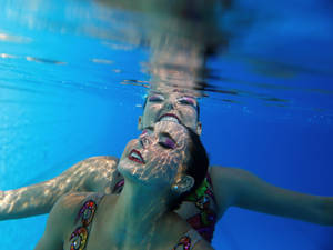 Synchronized Swimming Underwater Shot Wallpaper