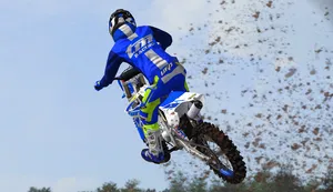 T M Racing Motocross Jump Wallpaper