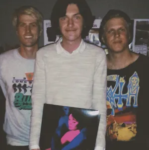 T V Girl Band Members With Vinyl Record Wallpaper