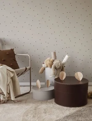 Table And Chair Against A Wall With Subtle Design Wallpaper