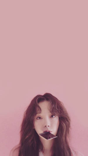 Taeyeon Biting A Polaroid Wallpaper