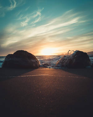 Take In The Beautiful Sunset At The Beach. Wallpaper